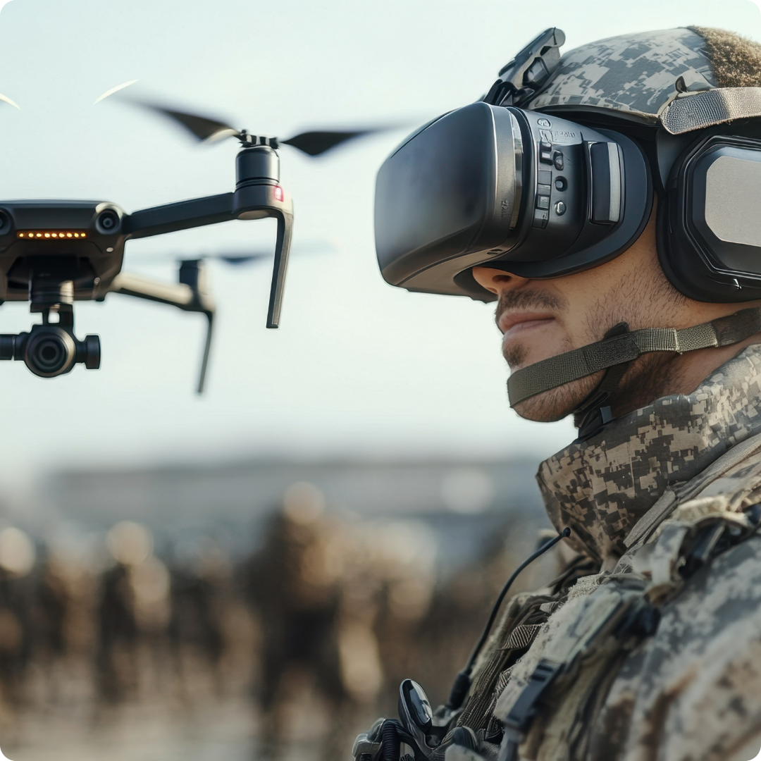 A soldier wearing a VR headset pilots a drone in a sunlit rural area, highlighting modern technology in military operations.